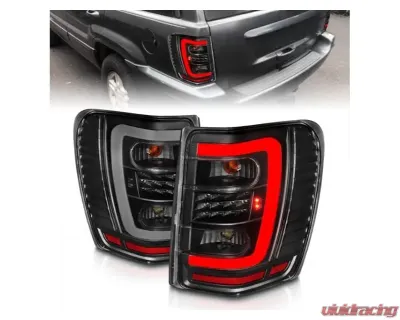 Anzo USA LED Tail Lights w/ Light Bar Black Housing Clear Lens Jeep Grand Cherokee 1999-2004 - 311394