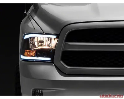 Raxiom Axial Series Clear Lens Black Housing Headlights w/ LED Bar Ram 1500 | 2500 | 3500 w/ Factory Halogen Non-Projector Headlights 2009-2018 - R131481