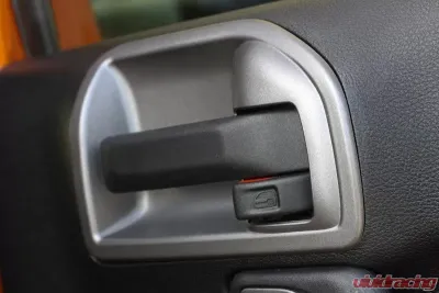 This charcoal door latch trim from Rugged Ridge fits 2011-2018 Jeep Wrangler JK Jeep Wrangler 2011-2018 - 11157.20