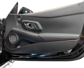 Revel GT Design Kick Panel Cover with Red Stitch Toyota Supra A90 2020-2024