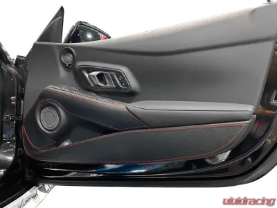 Revel GT Design Kick Panel Cover with Red Stitch Toyota Supra A90 2020-2024 - 1TR5GDAT02R